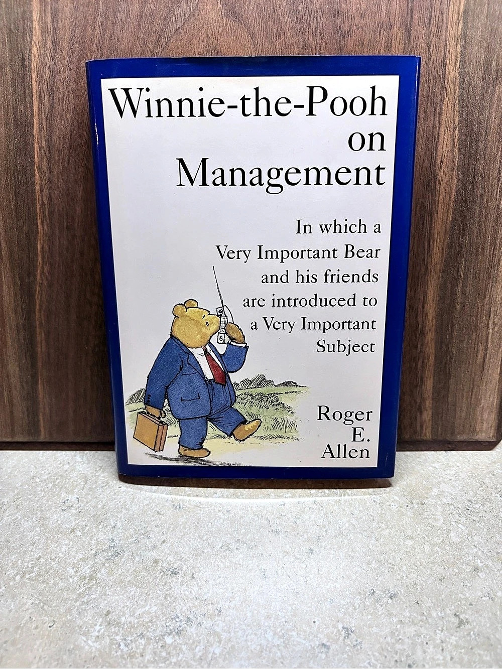 Dutton Winnie-the-Pooh on Management Blue & White Hardcover Book